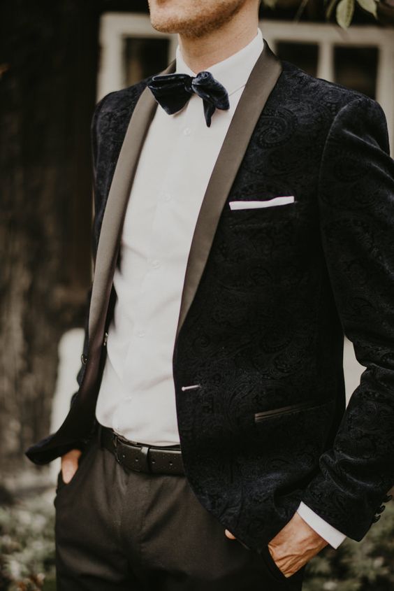 a chic vintage-inspired black velvet jacket and a black velvet bow tie for an exqusite look