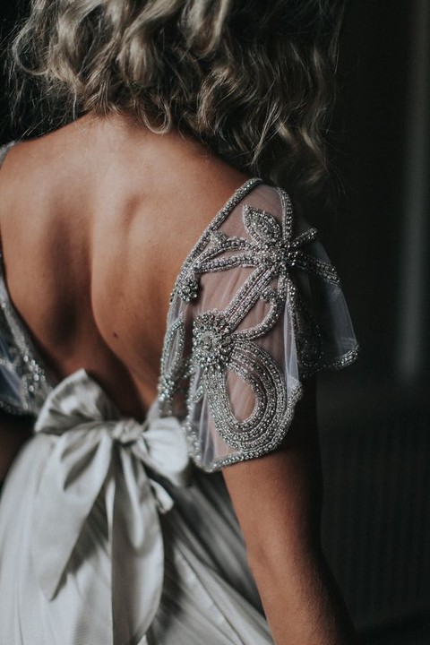 a flowy embroidered beaded silver cap sleeve looks really wow