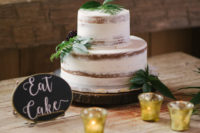 14 The wedding cake was a demi-naked one topped with greenery for a rustic feel