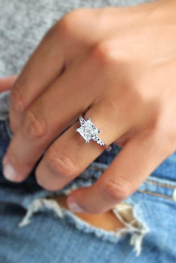 a white gold modern engagement ring with a square diamond and no halo looks bold and edgy