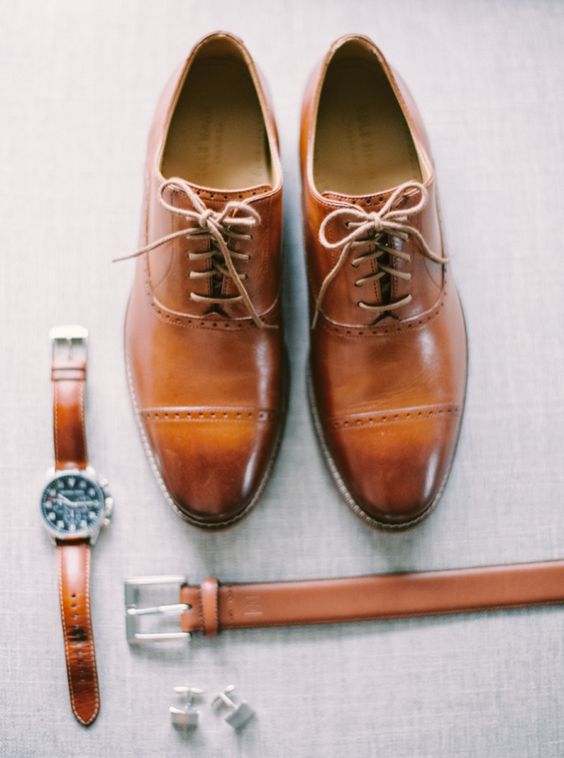 brown leather groom's accessories - a watch, a belt and shoes for a stylish look