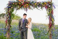 16 a fantastic colroful floral wedding arch will make a statement at a spring or summer boho wedding