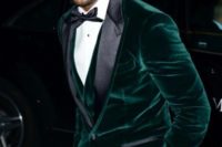 16 black pants worn with an emerald velvet waistcoat and jacket create a super chic look