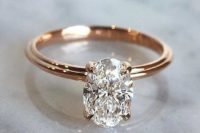 19 a rose gold engagement ring with an oval diamond solitaire is another classic idea to try