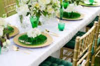 19 emerald glasses, plates and gold chargers and cutlery, lush white blooms