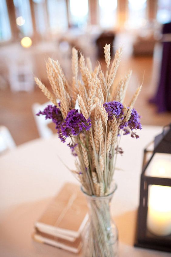 a rustic centerpiece with wheat and violet blooms is easy to make yourself