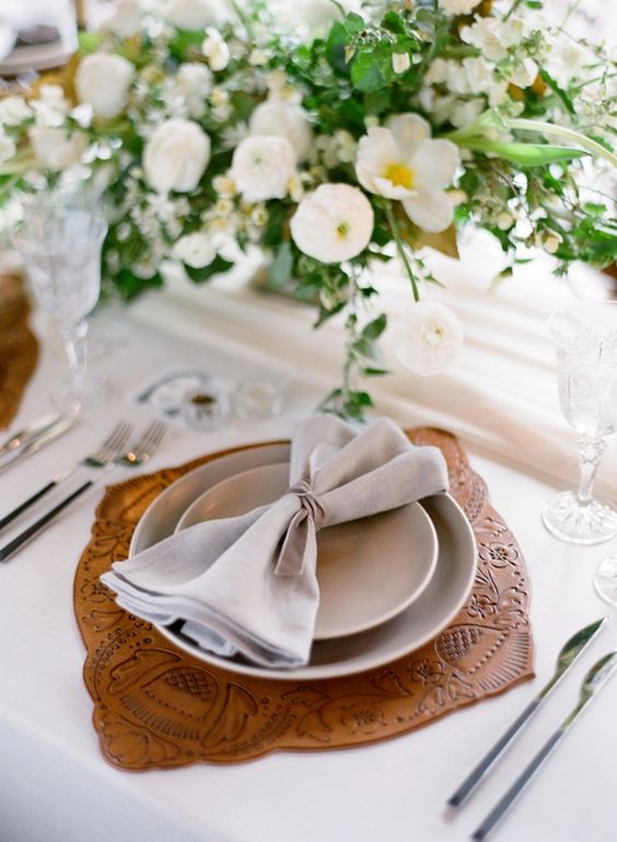 a stamped leather placemat for a chic textural touch to make the place setting cooler