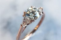 22 a rose gold engagement ring with a round diamond and no halo looks more modern