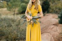 23 a mustard short sleeve wedding dress with a front slit for a non-traditional boho bride