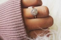 23 a round diamond engagement ring with a halo around looks girlish and chic