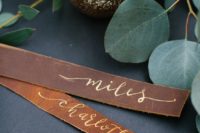 23 leather and calligraphy place cards look cute and can be easily DIYed