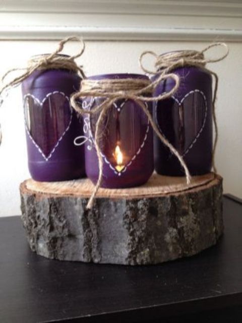ulta violet candle lanterns with hearts, twine and on a wood slice for a rustic wedding
