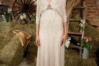 24 a heavily embellished wedding dress with long sleeves, a deep V-neckline shows retro glam