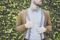 24 a neutral cardigan over a blue shirt and striped suspenders for a relaxed vintage and rustic look
