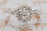 24 a vintage-inspired round halo vintage diamond engagement ring for a romantic girl