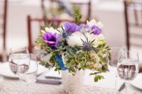 24 add some ultra violet blooms to a neutral floral centerpiece to make it trendier