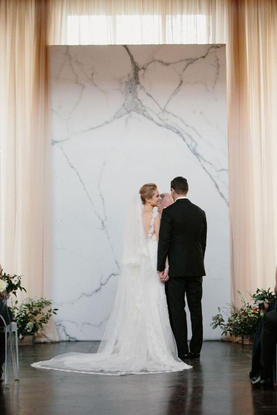 a timeless marble wedding backdrop for a minimalist wedding