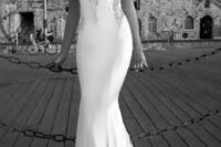 a gorgeous plain mermaid wedding dress with a deep sweetheart neckline and lace strpas, with lace inserts and a train is a sexy idea to show off your figure