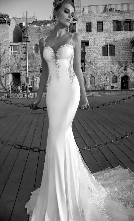 a gorgeous plain mermaid wedding dress with a deep sweetheart neckline and lace strpas, with lace inserts and a train is a sexy idea to show off your figure
