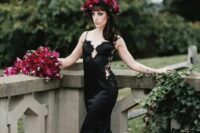 a mermaid spaghetti strap black wedding dress with lace, rhinestones and lace inserts and looked super sexy