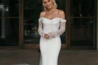 a modern mermaid fully embellished off the shoulder wedding dress with a long train will bring a touch of sparkle