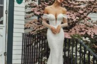 a sophisticated embellished mermaid off the shoulder wedding dress with a plunging neckline and a train is always a very sexy option to try