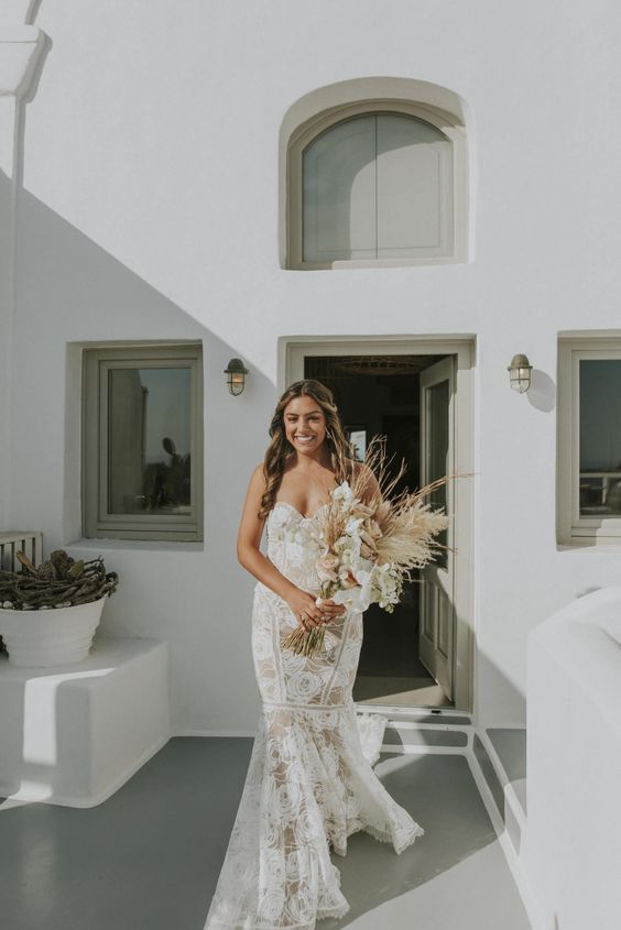 a strapless lace mermaid wedding dress with a train is a great idea for a boho bride, it looks very relaxed and sexy