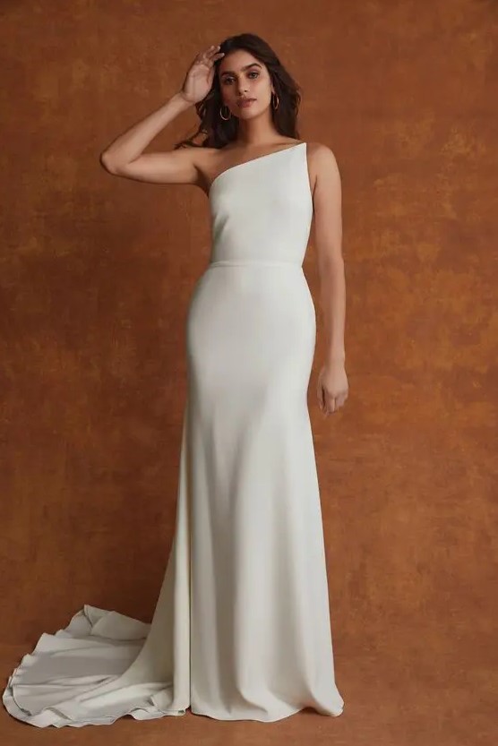 an ultra-minimalist one shoulder semi-fitting wedding dress with a sash and a train - you won't need anything else to make a statement