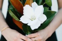 03 a magnolia leaf and single bloom bouquet is an elegant option for a bridesmaid