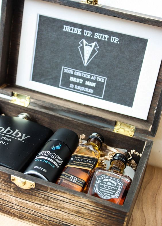 a stained wooden box with alcohol, a personalized flask and a deodorant