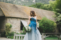 03 a strapless bold blue to light slate grey wedding dress with a train