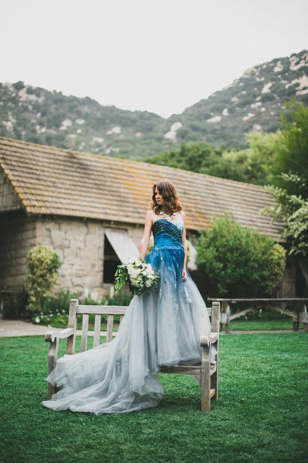 a strapless bold blue to light slate grey wedding dress with a train