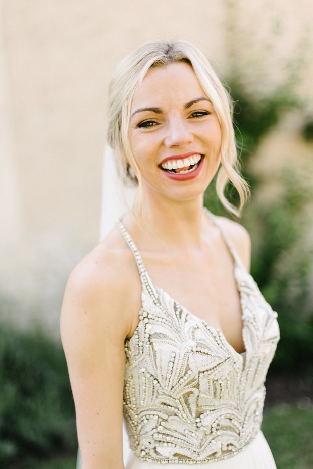 She chose a gorgeous wedding dress with spaghetti straps and a heavily embellished bodice