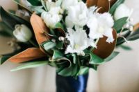 04 a chic and fresh wedding bouquet with white tulips and magnolia leaves