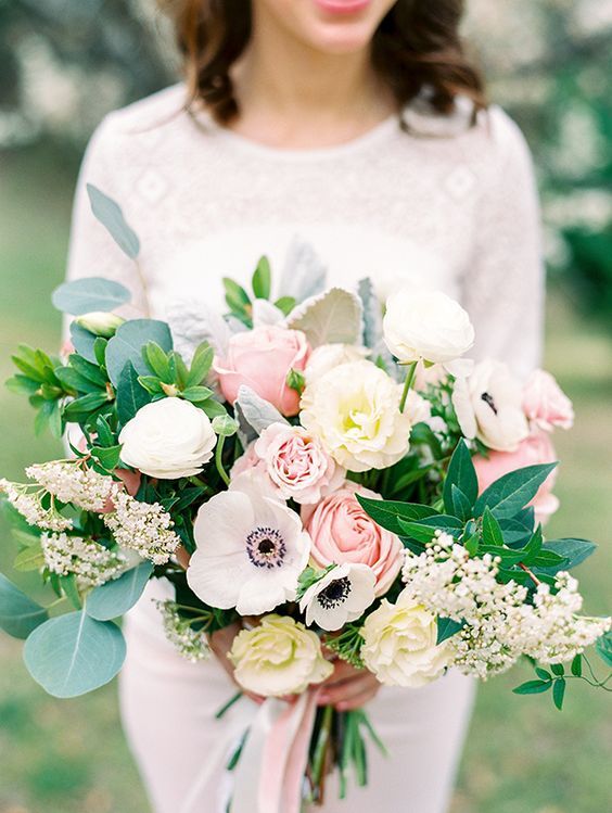 textural wedding bouquet with pink and white roses, white anemones, greenery and some little blooms