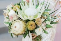 05 The bridal bouquet was done with king proteas, greenery and astilbe
