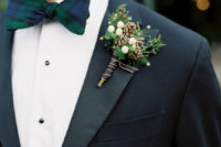 05 The groom was wearing a black tux with a black watch tartan bow tie and a bold boutonniere