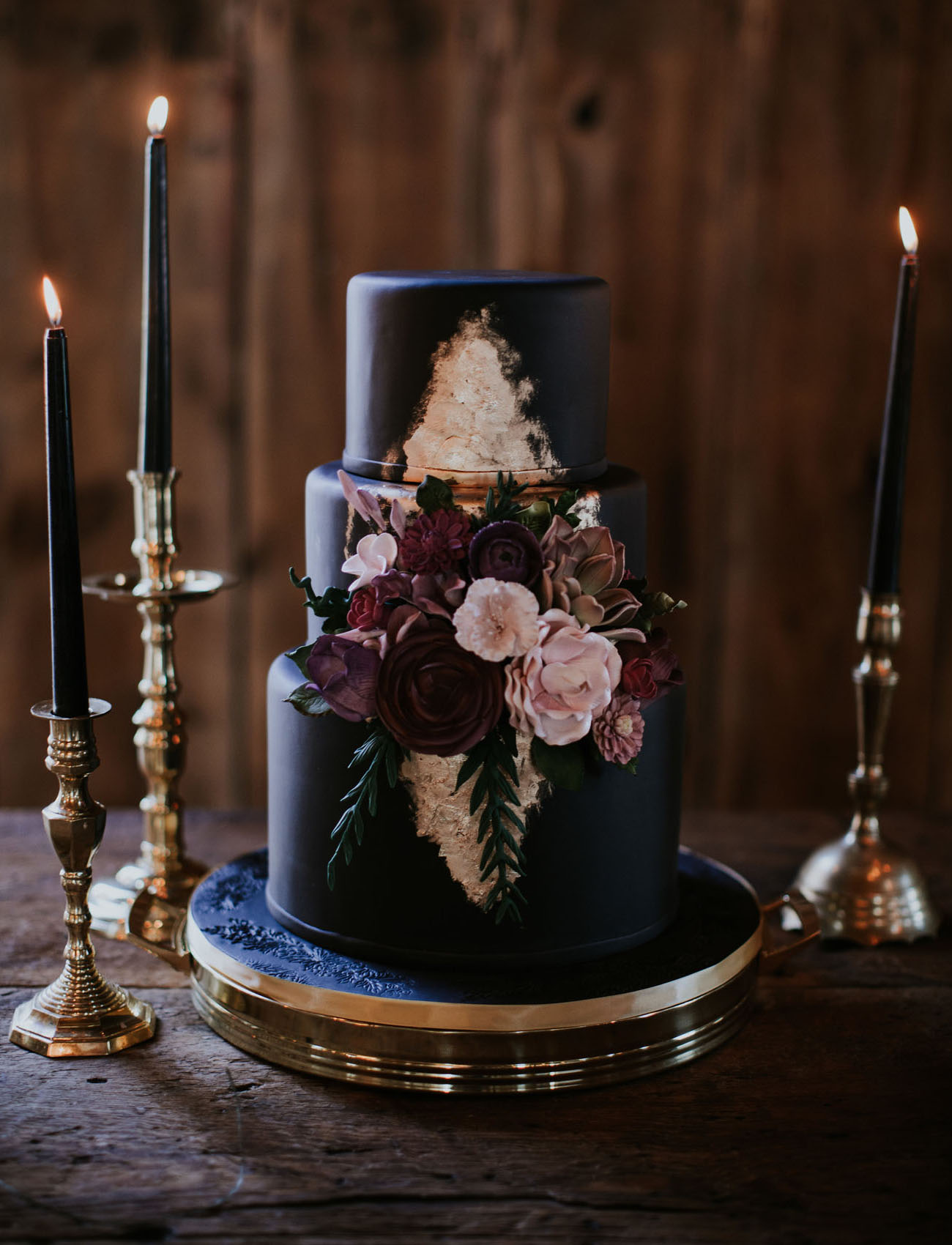 The wedding cake was a black one, with gold leaf and sugar flowers