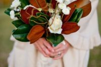 05 a magnolia leaf wedding bouquet with white blooms looks timeless
