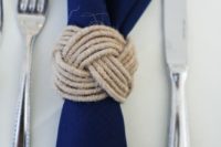 06 a navy napkin with a twine kot napkin ring for a nautical wedding