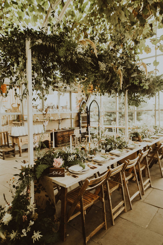 The reception was in a cheese shop, it was decorated with lush greenery and florals all over