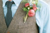 07 a chambray shirt, a grey tie and a brown waistcoat with a coral bloom boutonniere