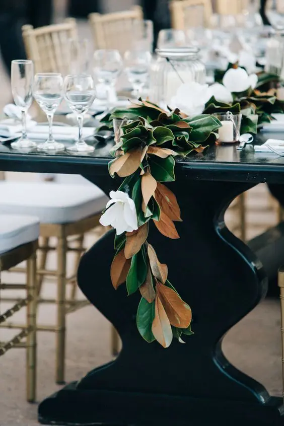 a magnolia leaf garland with white blooms for an elegant feel
