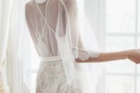 08 a short sheer bridal robe with half sleeves, a lace trim and gold embroidery over a white lace romper for the wedding day