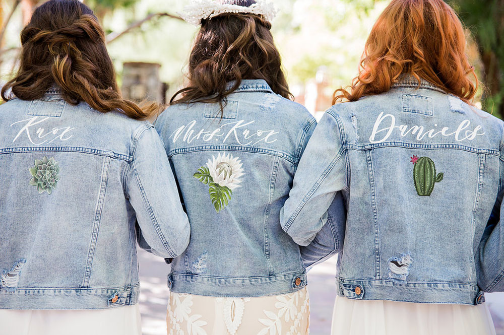 The bridesmaids were wearing distressed denim jackets with desert plants