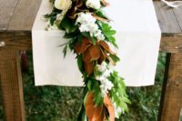 09 a magnolia leaf garland can be accessorized with neutral blooms for a chic look