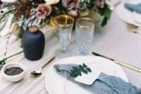 09 an ethereal and moody tablescape with slate grey napkins, gold rim glasses and moody florals looks chic