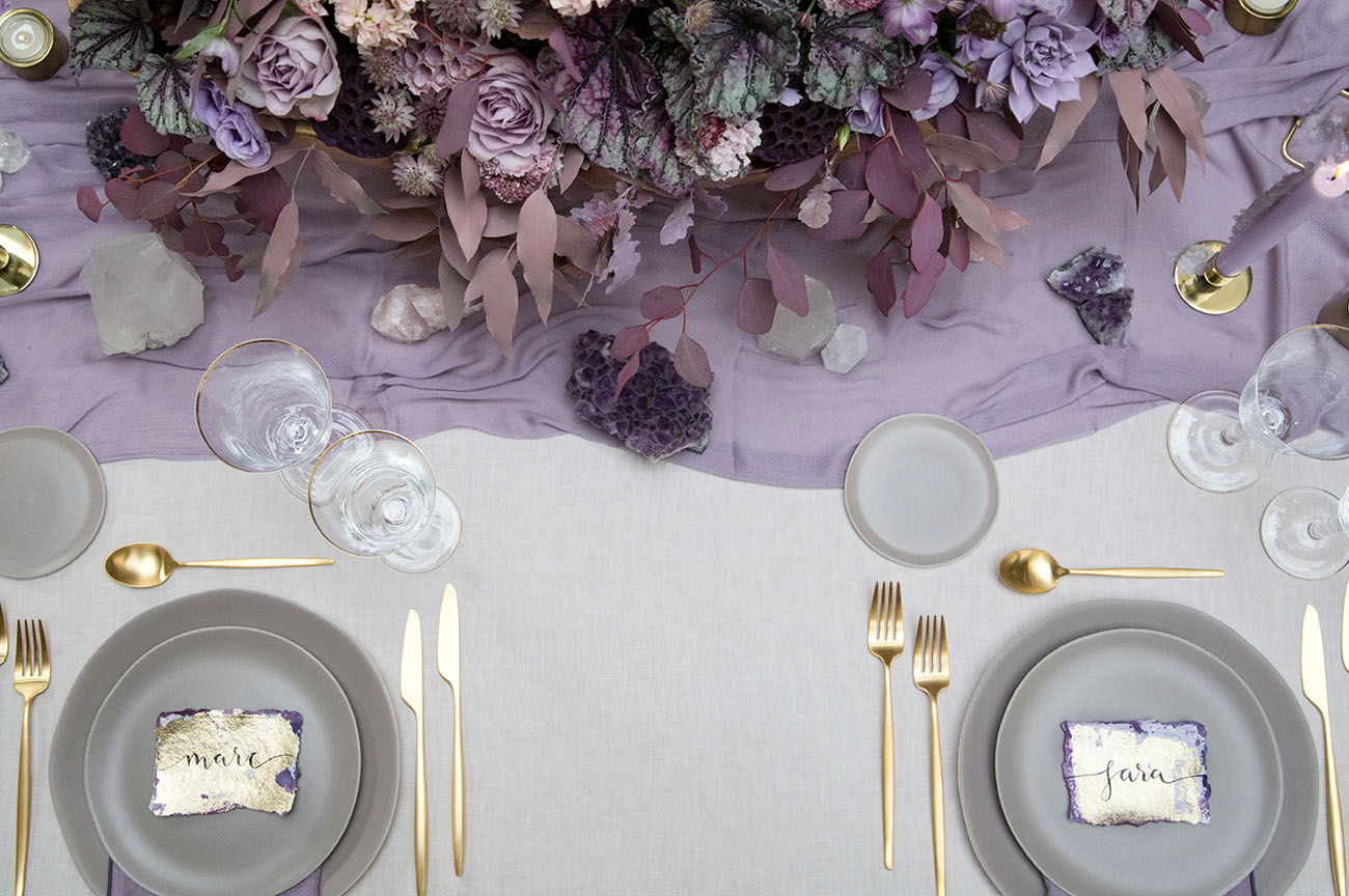 Go for amethysts, gold touches and colored candles to create a jaw dropping table setting