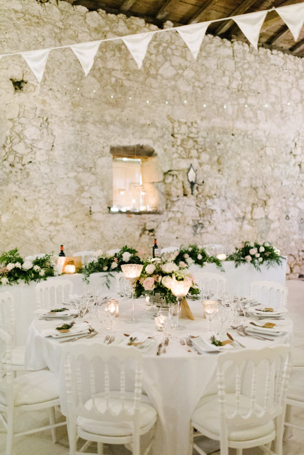 The wedding reception was very romantic and elegant, with lush blooms and foliage and candles