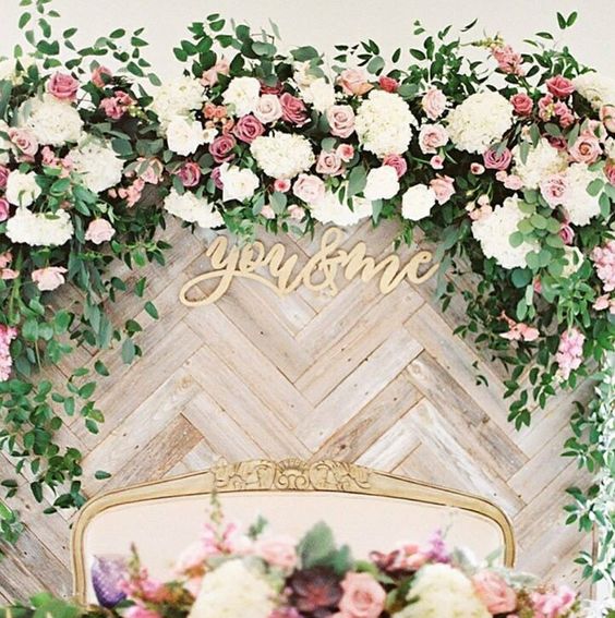 chevron-clad wooden backdrop with lush blooms and foliage for a chic look